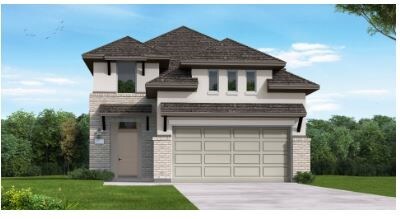 view of front of home featuring a front yard and a garage