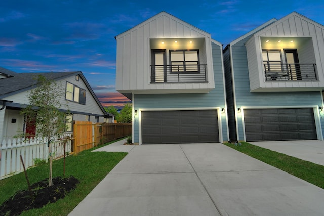 view of front of house featuring a balcony and a garage