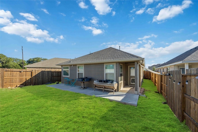 back of property with an outdoor hangout area, a patio area, and a lawn