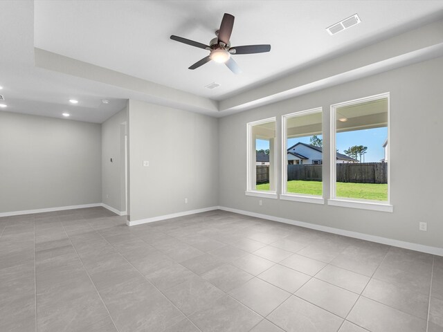 unfurnished room featuring ceiling fan and light tile patterned flooring