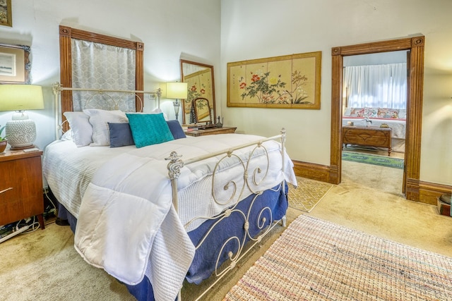 bedroom featuring light colored carpet