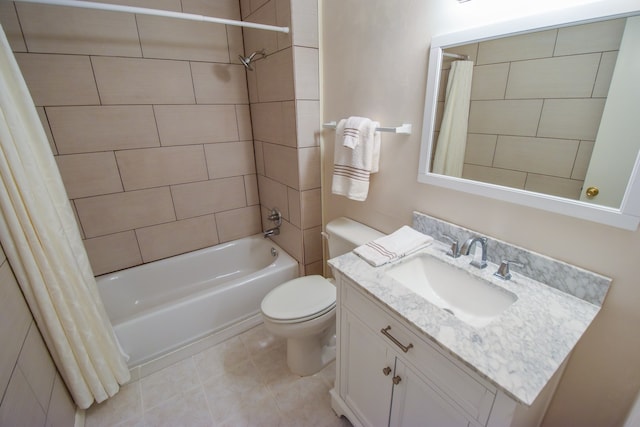 full bathroom with tile patterned flooring, shower / bath combo with shower curtain, vanity, and toilet