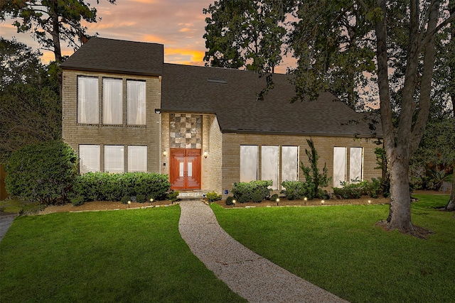 contemporary house featuring a lawn