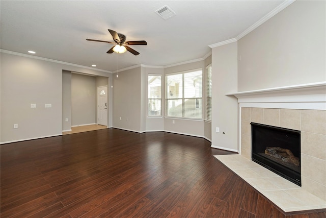 unfurnished living room with hardwood / wood-style flooring, ceiling fan, ornamental molding, and a fireplace