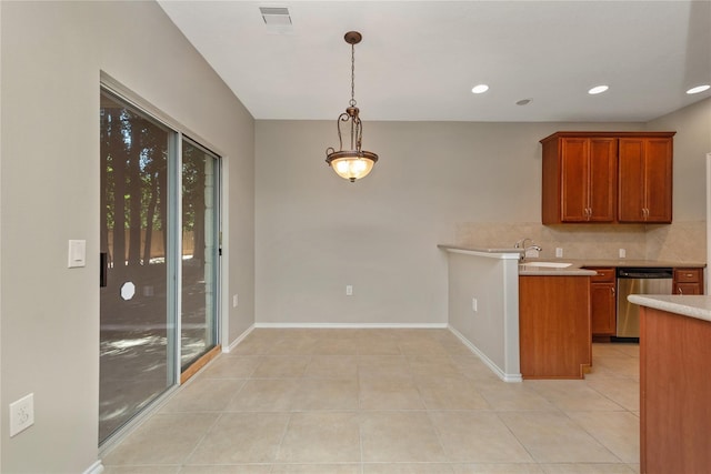 kitchen with sink, hanging light fixtures, stainless steel dishwasher, decorative backsplash, and light tile patterned floors