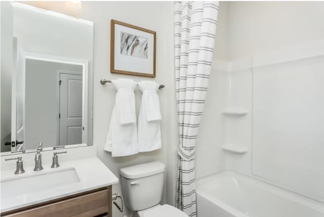 full bathroom featuring toilet, vanity, and shower / tub combo with curtain