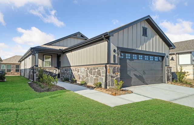 view of front facade featuring a garage, stone siding, a front lawn, and board and batten siding