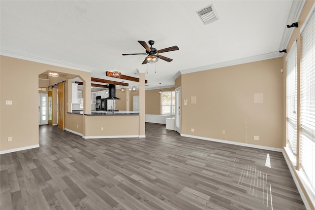 unfurnished living room featuring crown molding, hardwood / wood-style floors, and ceiling fan