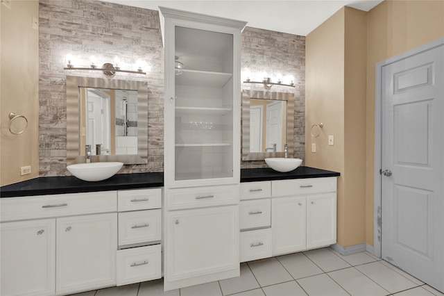 bathroom with tile patterned floors and vanity