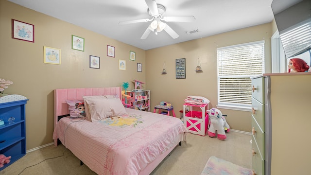 bedroom with light colored carpet and ceiling fan