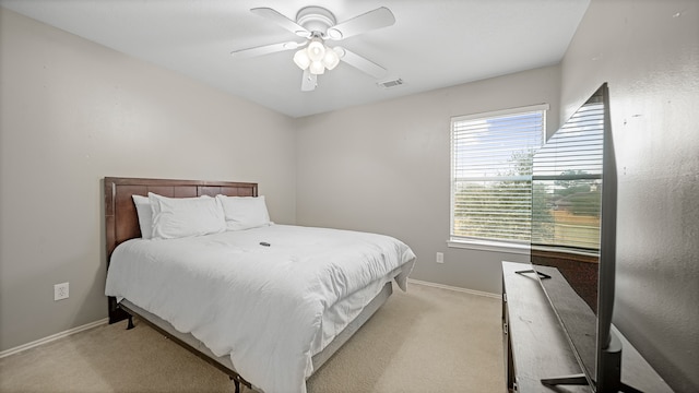 carpeted bedroom featuring ceiling fan