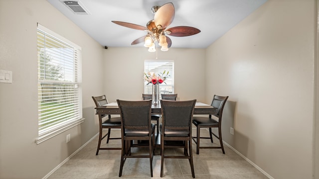 dining area featuring ceiling fan and light tile patterned floors