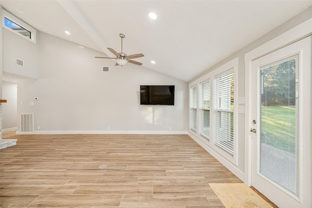 unfurnished living room featuring ceiling fan, light hardwood / wood-style floors, and vaulted ceiling