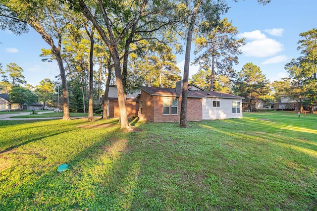 view of property exterior with a yard