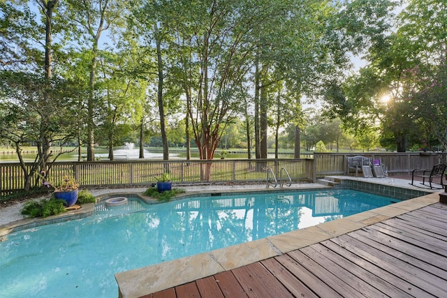 view of pool with a wooden deck