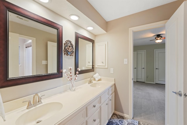 bathroom featuring ceiling fan and vanity