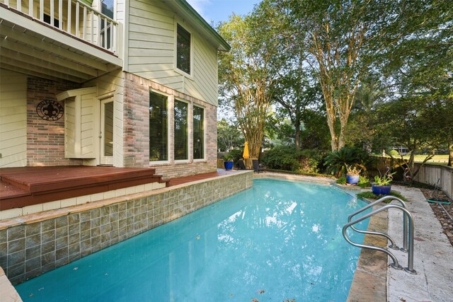 view of swimming pool featuring a deck