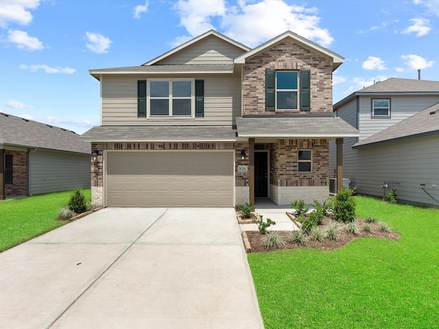 view of front of house with a garage and a front lawn