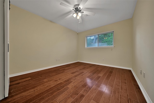 empty room featuring ceiling fan and dark wood-type flooring