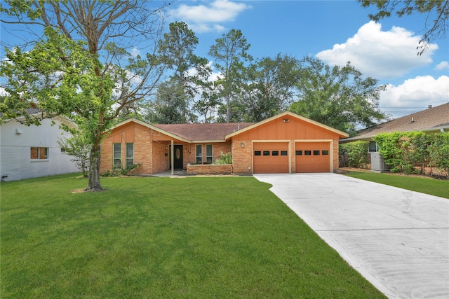 ranch-style home with a front yard and a garage