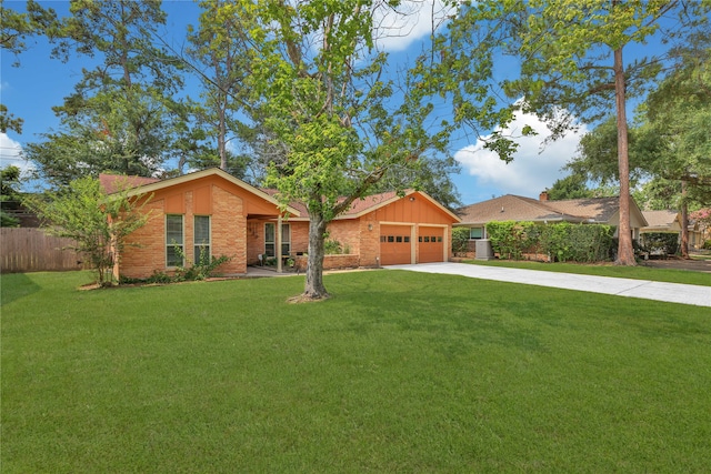 ranch-style home with a garage and a front yard