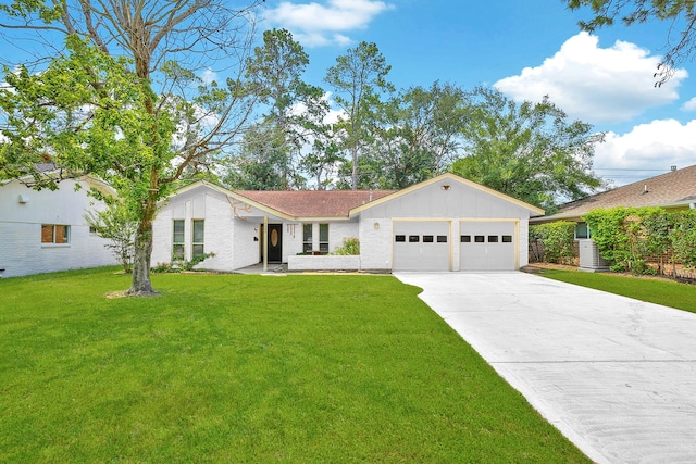 ranch-style home with a garage and a front yard