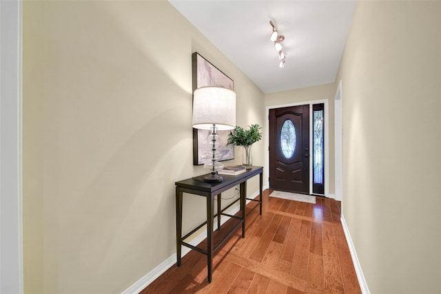 entryway with wood-type flooring