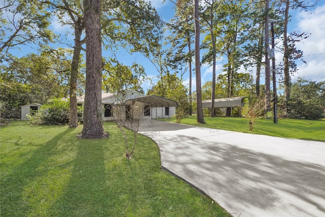 single story home featuring a carport and a front yard