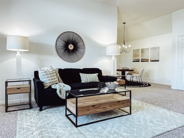 carpeted living room featuring a chandelier