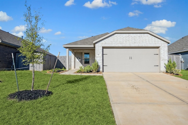 single story home with a front yard and a garage