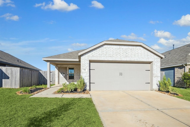 ranch-style home featuring a garage and a front lawn