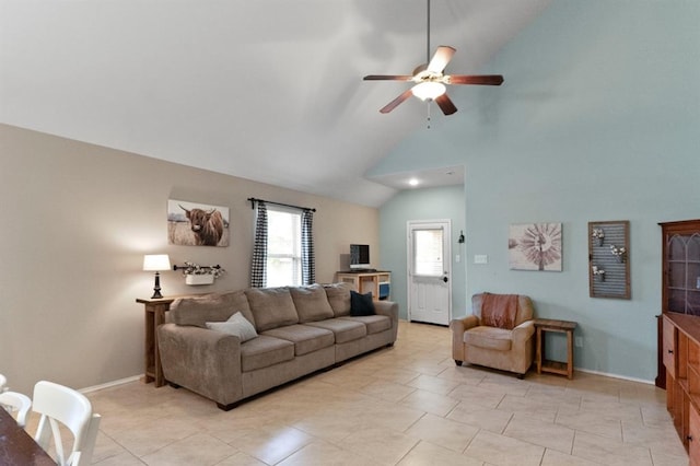 tiled living room featuring ceiling fan and high vaulted ceiling