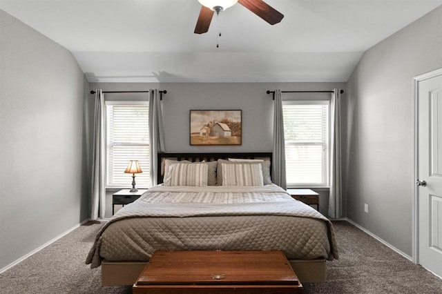 carpeted bedroom with vaulted ceiling and ceiling fan