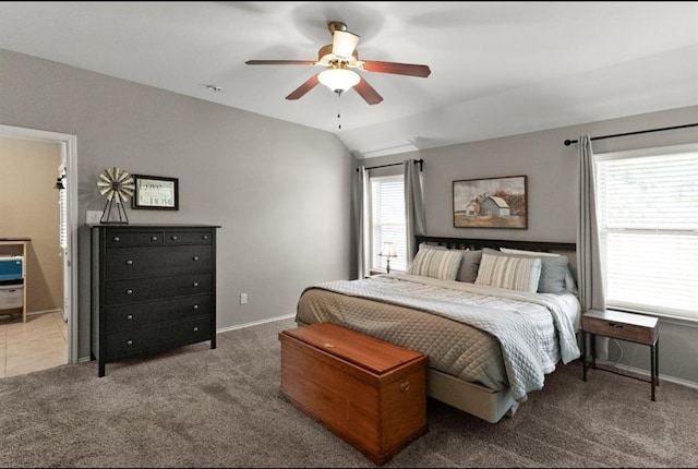 bedroom featuring carpet, ceiling fan, and vaulted ceiling