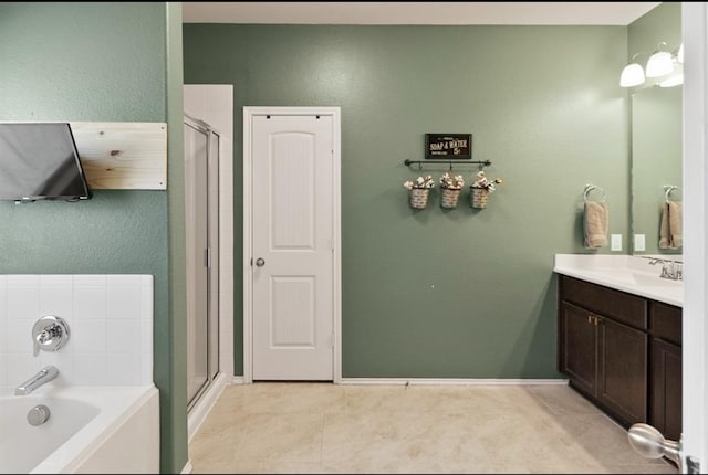 bathroom with tile patterned floors, vanity, and independent shower and bath