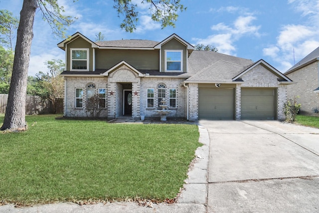 view of front of property featuring a front lawn and a garage