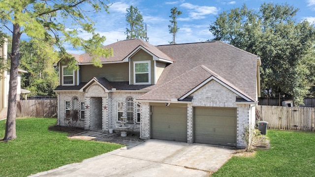 view of front of house with a front yard and a garage