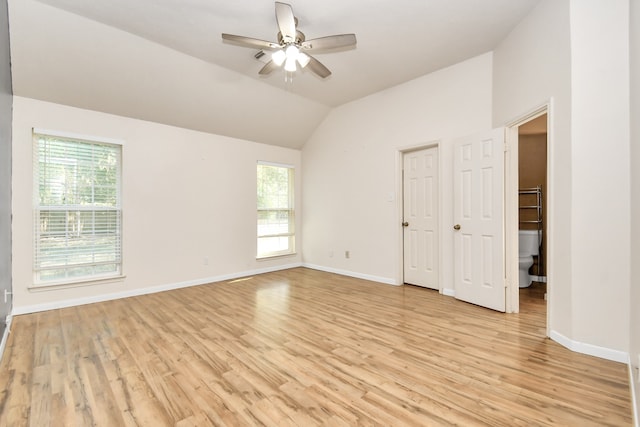 interior space featuring a wealth of natural light, light hardwood / wood-style flooring, ceiling fan, and vaulted ceiling