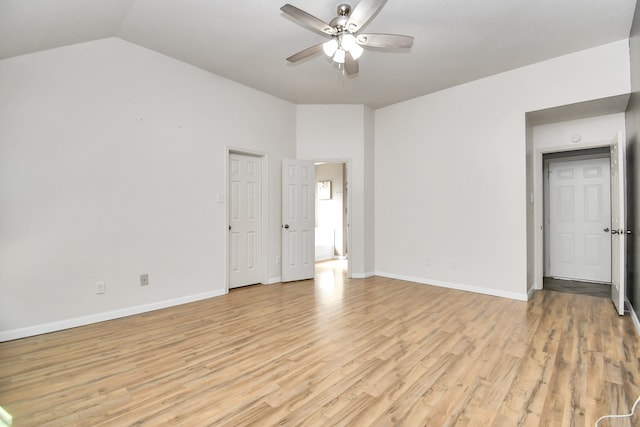 empty room featuring light hardwood / wood-style floors, ceiling fan, and lofted ceiling