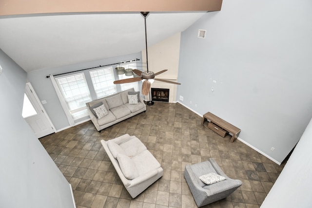 living room featuring high vaulted ceiling