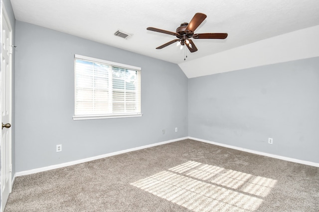 unfurnished room featuring carpet, ceiling fan, and lofted ceiling