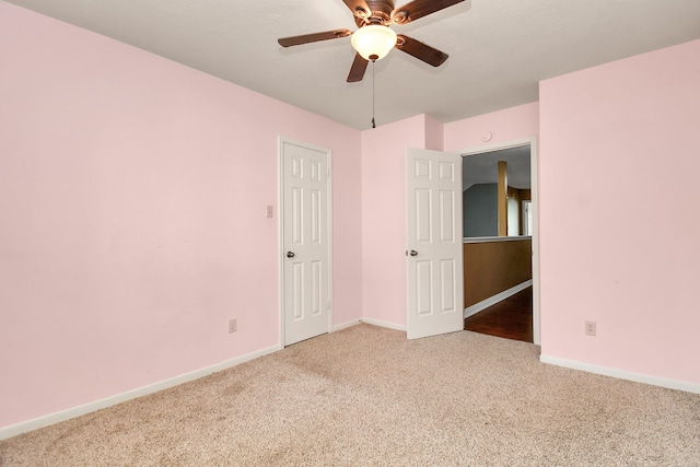 unfurnished room featuring carpet and ceiling fan