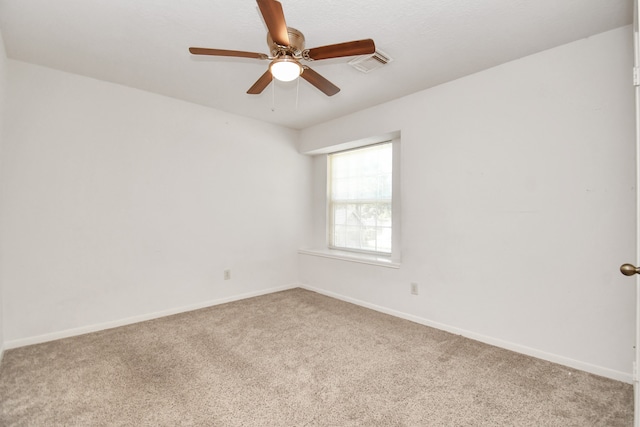 empty room with carpet and ceiling fan