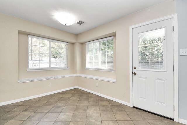 interior space with light tile patterned floors