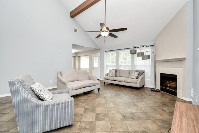 living room with ceiling fan, beamed ceiling, and high vaulted ceiling