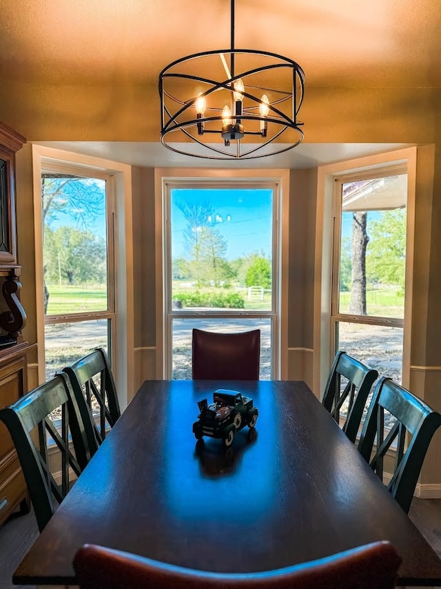 dining space with a chandelier and a healthy amount of sunlight