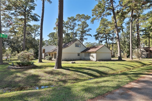 view of side of property with a yard