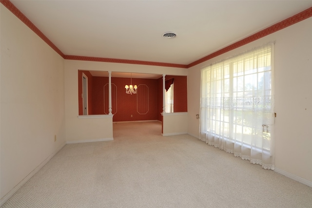 carpeted empty room with a chandelier and ornamental molding