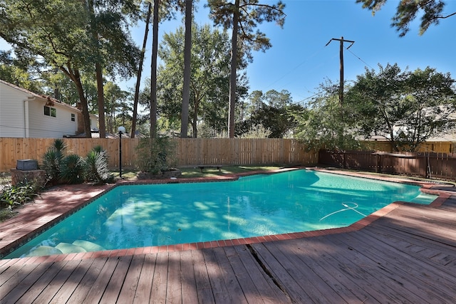 view of swimming pool featuring a deck