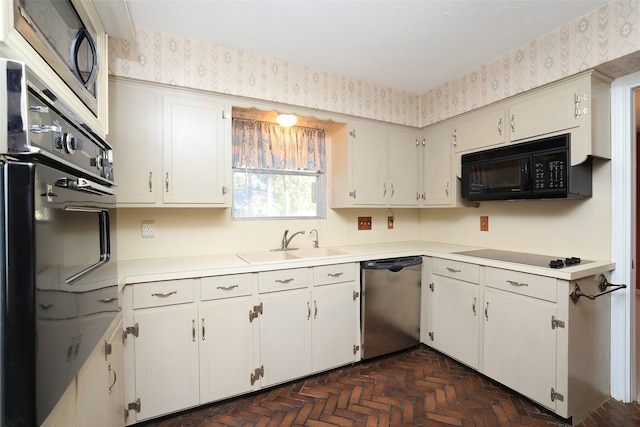 kitchen featuring white cabinets, sink, and black appliances